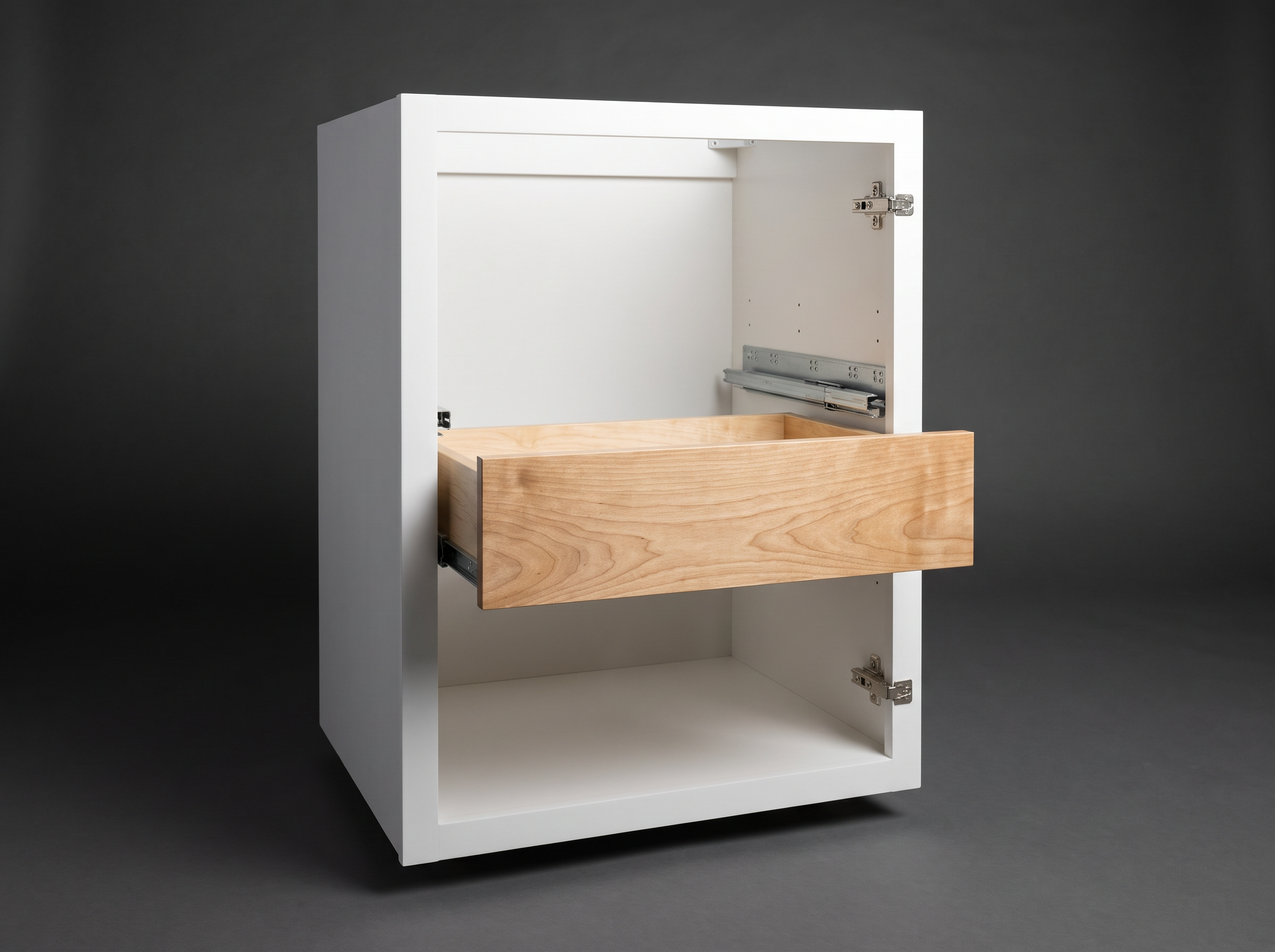 Open white shaker base cabinet on a charcoal studio sweep — construction study
